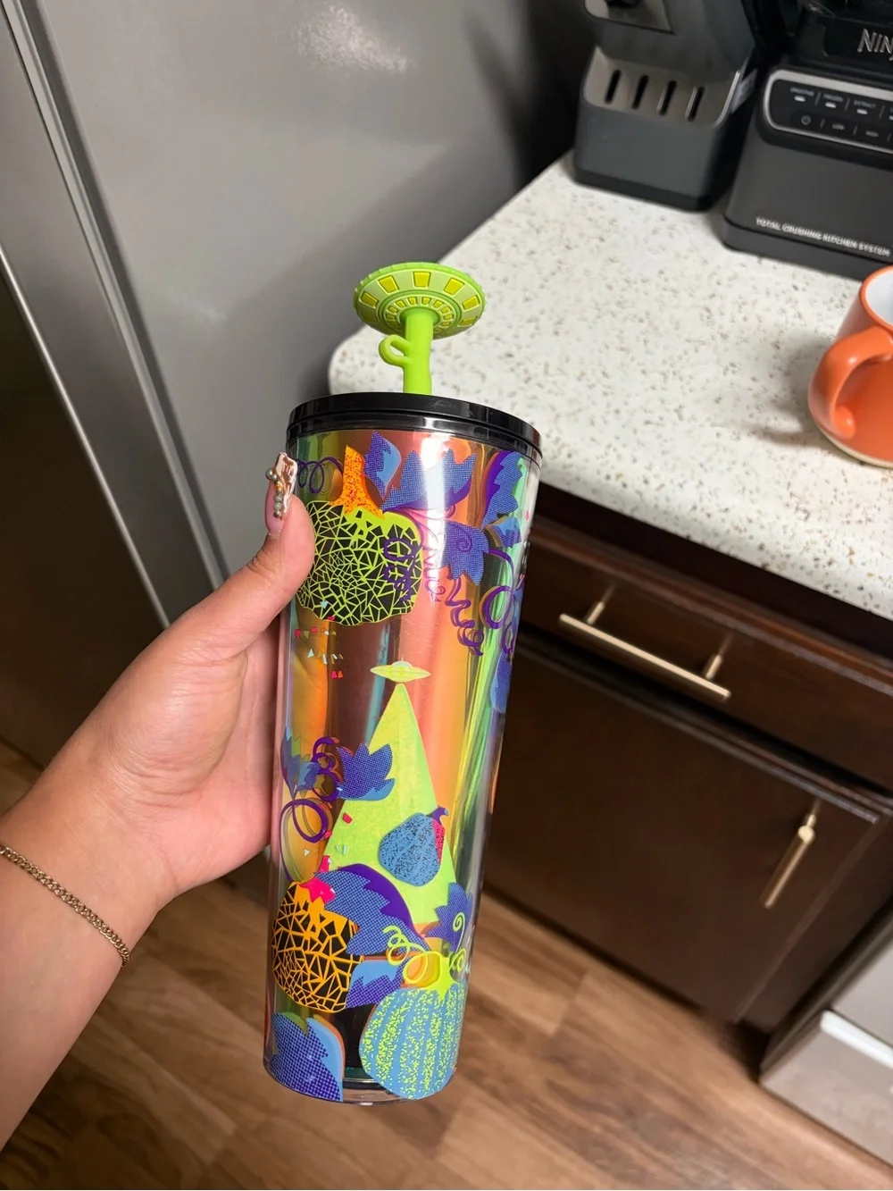 Starbucks Iridescent Tumbler with Neon Green Lid and Multi-Color Fruit Motifs